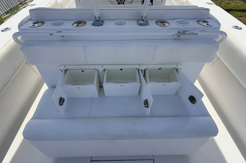 Slide: The Image of White seating with storage compartments on a 2008 SeaHunter 40 Tournament boat. - 26