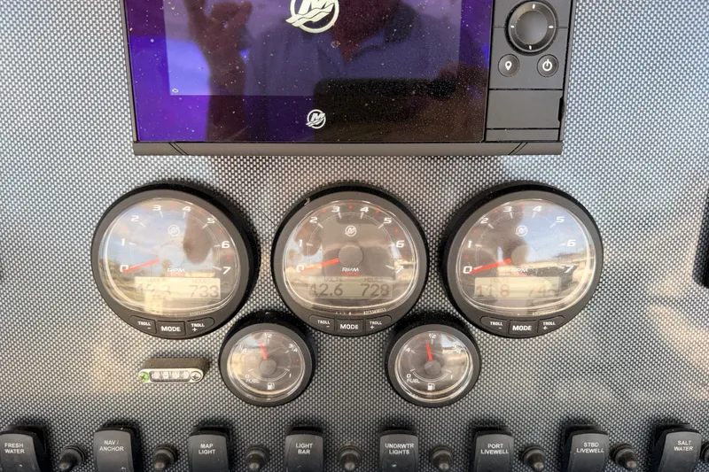 Slide: The Image of Dashboard of a 2008 SeaHunter 40 Tournament boat with gauges and controls. - 8