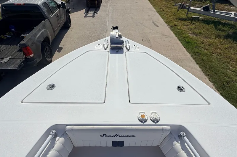 Slide: The Image of Bow view of 2008 SeaHunter 40 Tournament boat on trailer, with truck nearby. - 16