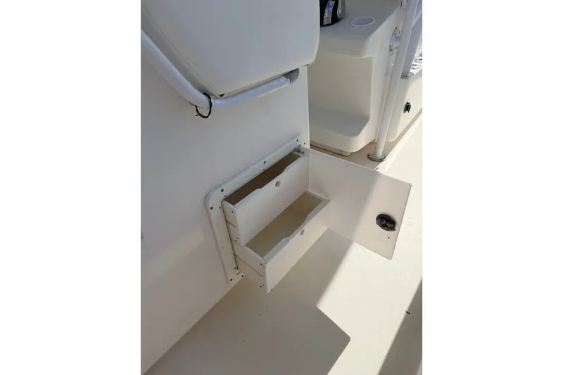 Slide: The Image of Open storage compartment on a 2008 SeaHunter 40 Tournament boat deck. - 24