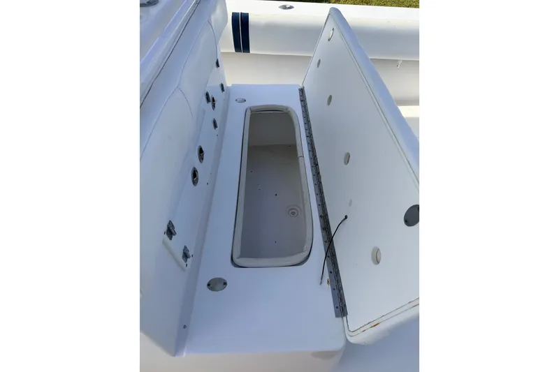 Slide: The Image of Open storage compartment on 2008 SeaHunter 40 Tournament boat deck. - 27