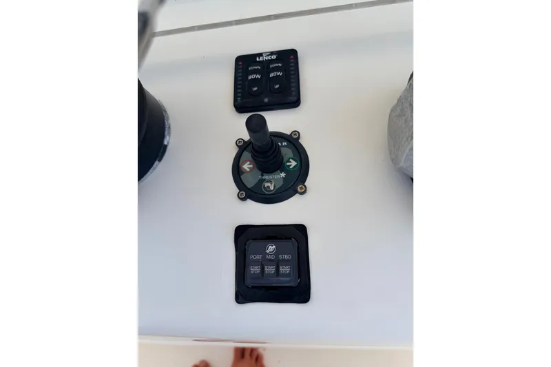 Slide: The Image of Control panel of a 2008 SeaHunter 40 Tournament boat with joystick and buttons. - 10