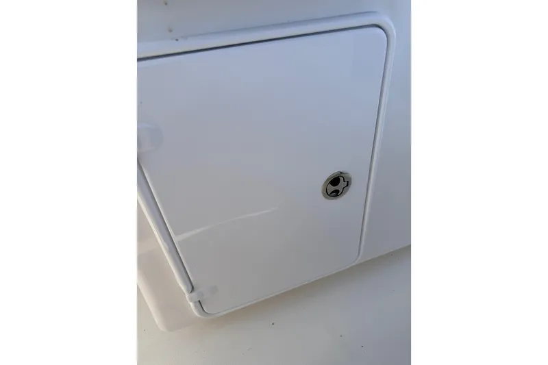 Slide: The Image of White storage compartment on a 2008 SeaHunter 40 Tournament boat. - 21