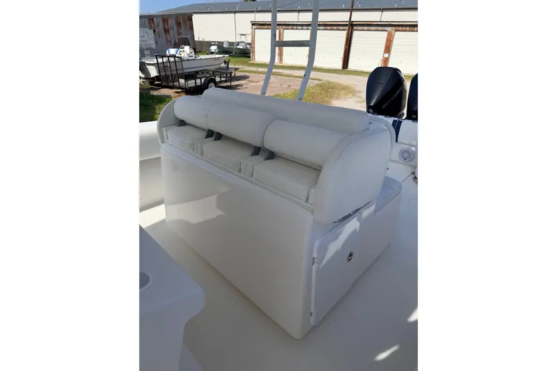 Slide: The Image of 2008 SeaHunter 40 Tournament boat interior with cushioned seating and storage. - 12