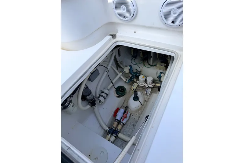 Slide: The Image of Bilge compartment of 2008 SeaHunter 40 Tournament boat with visible pumps and wiring. - 29