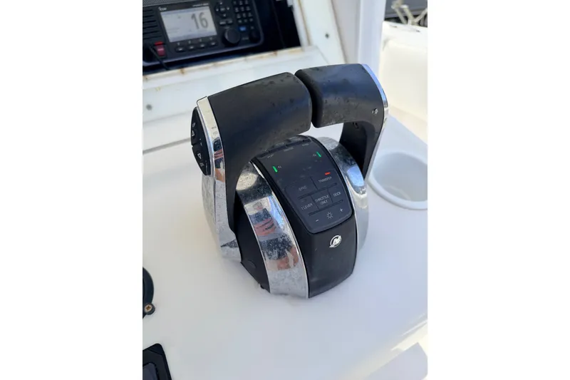 Slide: The Image of Throttle controls on a 2008 SeaHunter 40 Tournament boat dashboard. - 11
