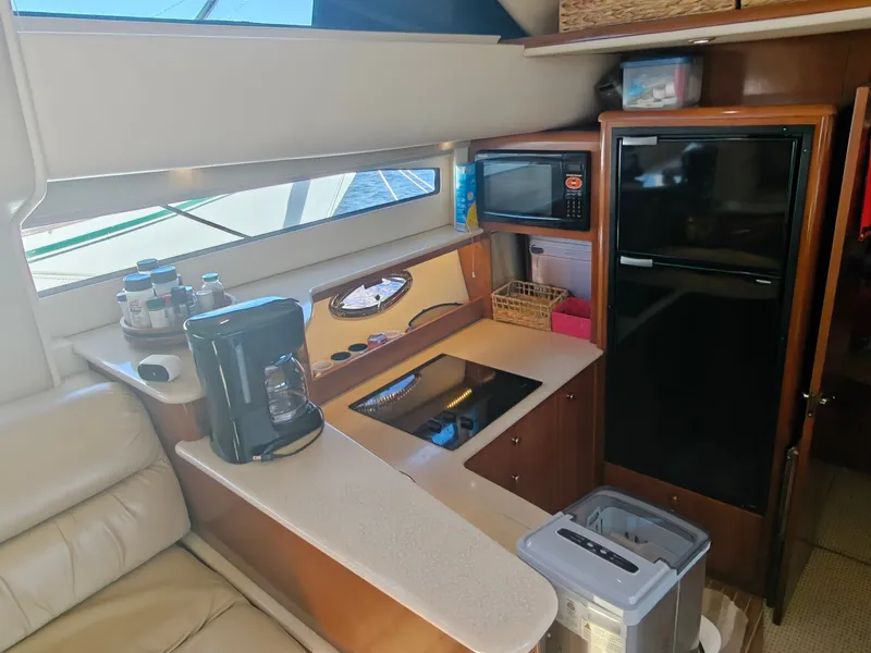 Slide: The Image of Interior of 2005 Meridian 408 Motoryacht with kitchen and appliances. - 19