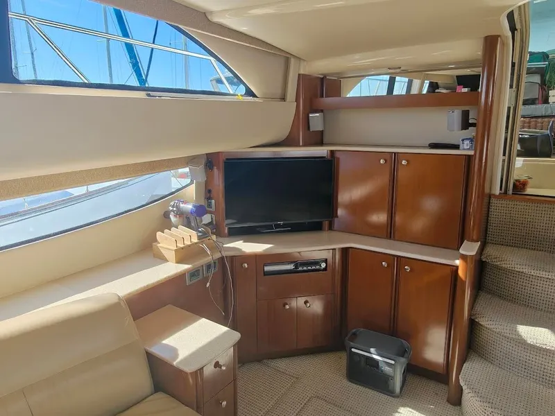 Slide: The Image of Interior of 2005 Meridian 408 Motoryacht with TV and wooden cabinets. - 20