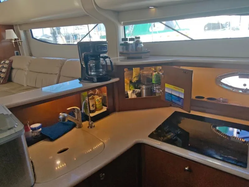 Slide: The Image of Interior of 2005 Meridian 408 Motoryacht with kitchen and sofa. - 21
