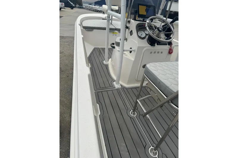 Slide: The Image of 2024 Carolina Skiff 192 JLS boat interior with steering console and seating. - 11