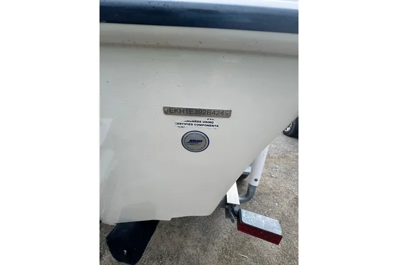 Slide: The Image of 2024 Carolina Skiff 192 JLS boat hull with identification plate and certification sticker. - 13