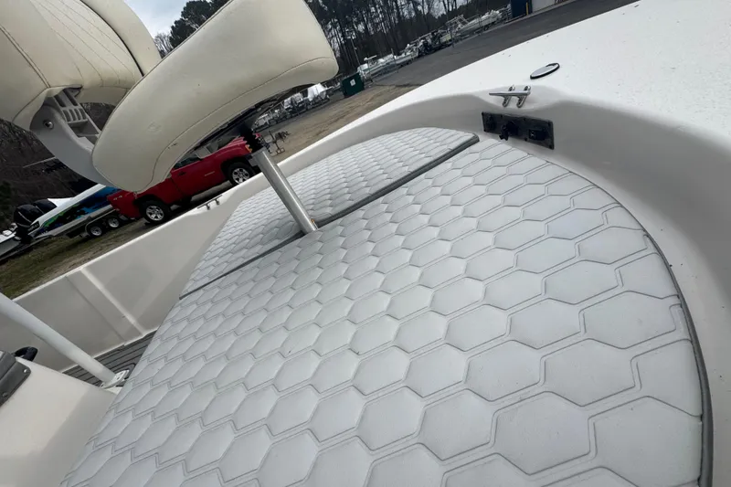 Slide: The Image of 2024 Carolina Skiff 192 JLS boat deck with hexagonal pattern and seating. - 14