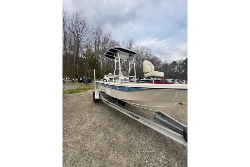 Slide: The Image of 2024 Carolina Skiff 192 JLS boat on trailer, parked outdoors. - 2