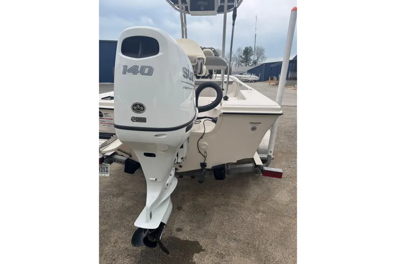 Slide: The Image of 2024 Carolina Skiff 192 JLS boat with Suzuki 140 outboard motor, rear view. - 3