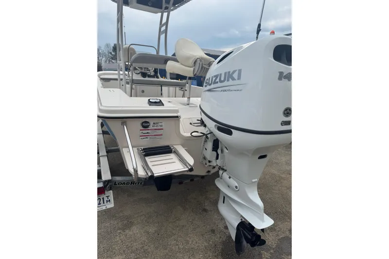 Slide: The Image of 2024 Carolina Skiff 192 JLS boat with Suzuki outboard motor, rear view. - 4