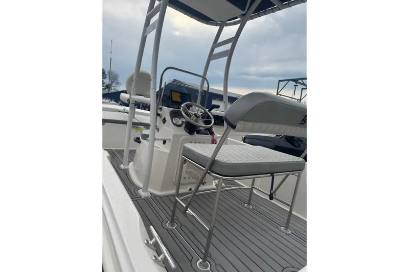 Slide: The Image of 2024 Carolina Skiff 192 JLS boat interior with steering console and seating. - 7