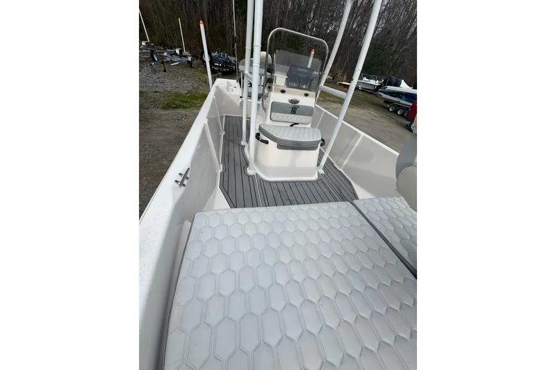 Slide: The Image of 2024 Carolina Skiff 192 JLS boat interior with textured flooring and seating. - 8