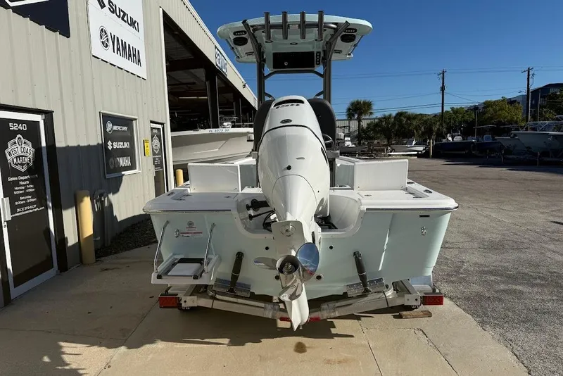 Slide: The Image of 2026 Sea Pro 210 Bay boat on trailer at marine dealership. - 3