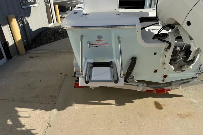 Slide: The Image of 2026 Sea Pro 210 Bay boat stern with ladder and engine mount. - 4