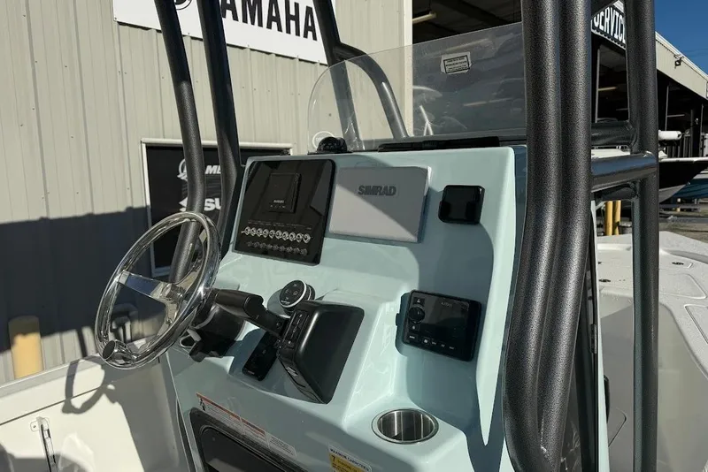 Slide: The Image of 2026 Sea Pro 210 Bay boat console with steering wheel and navigation equipment. - 6