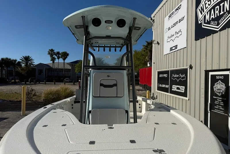 Slide: The Image of 2026 Sea Pro 210 Bay boat at West Coast Marine dealership, sunny day. - 7