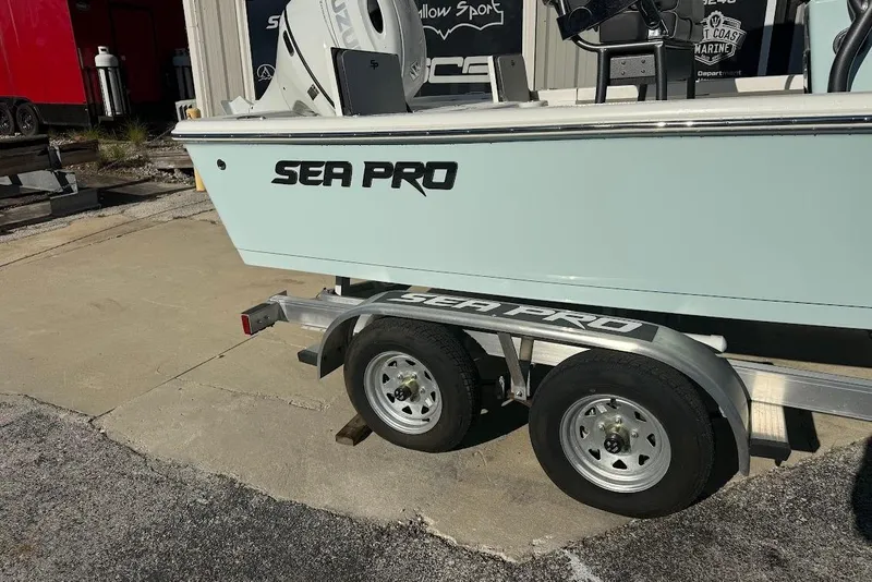 Slide: The Image of 2026 Sea Pro 210 Bay boat on trailer, displayed outdoors. - 9