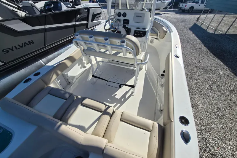 Slide: The Image of 2017 NauticStar 2102 Legacy boat interior with seating and control console. - 3