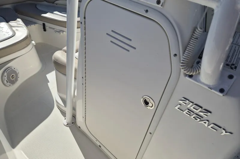 Slide: The Image of 2017 NauticStar 2102 Legacy boat interior with seating and storage compartment. - 9