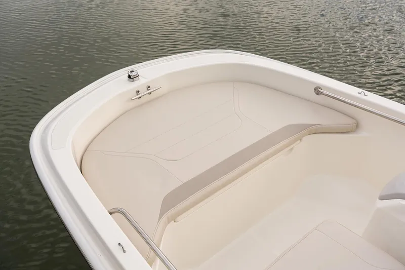 Slide: The Image of Manufacturer Provided Image: 2022 Boston Whaler 130 Super Sport boat interior, front seating area on calm water. - 5