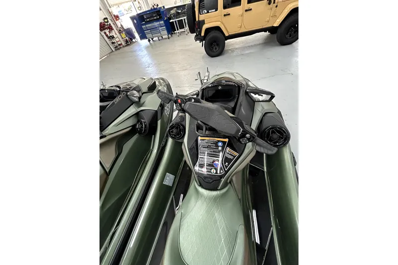 Slide: The Image of 2023 Sea-Doo GTX Limited 300 jet ski in a garage setting. - 2