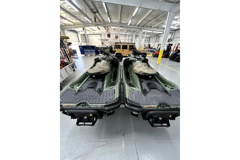 Slide: The Image of 2023 Sea-Doo GTX Limited 300 jet skis in a spacious indoor garage. - 4