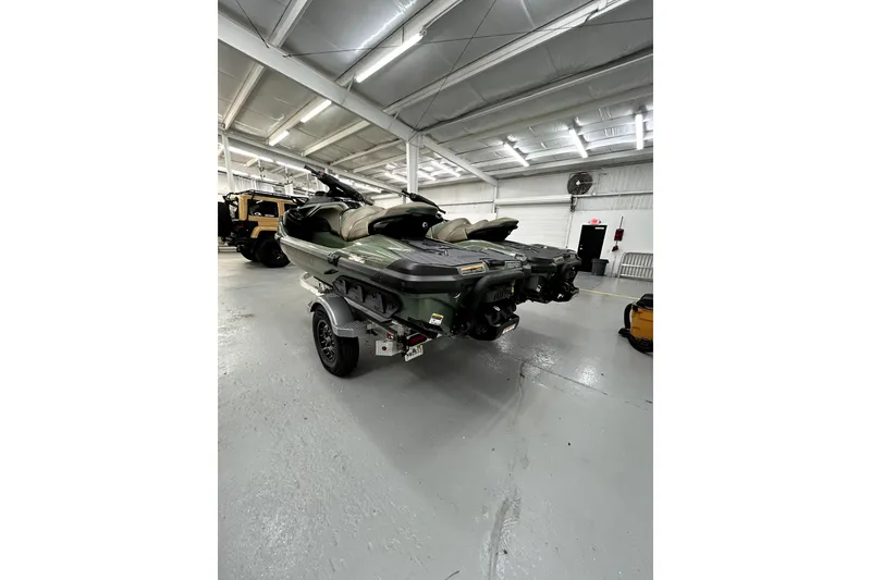 Slide: The Image of 2023 Sea-Doo GTX Limited 300 jet ski on trailer in a spacious garage. - 5