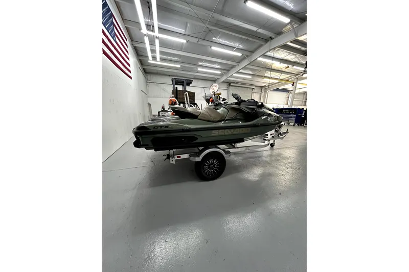 Slide: The Image of 2023 Sea-Doo GTX Limited 300 jet ski on trailer in a garage. - 8