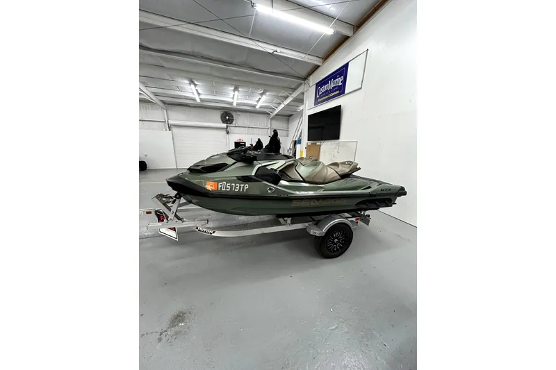 Slide: The Image of 2023 Sea-Doo GTX Limited 300 jet ski on trailer in indoor showroom. - 9