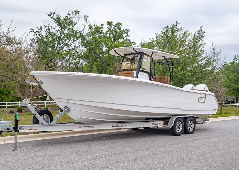 The Image of Sea Hunt ULTRA 305 CB 2026 on trailer, side view. - 1