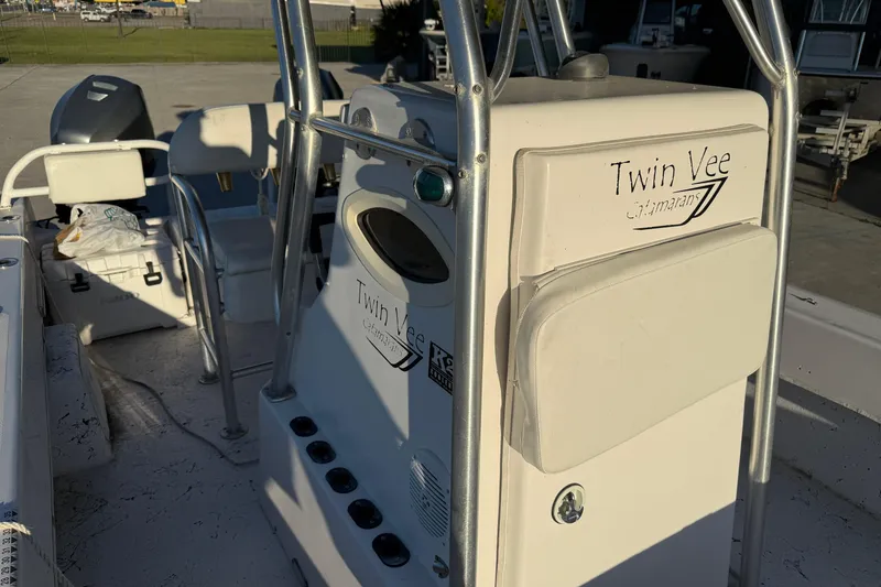 Slide: The Image of 2007 Twin Vee 26 Center Console boat interior with steering console and seating. - 10