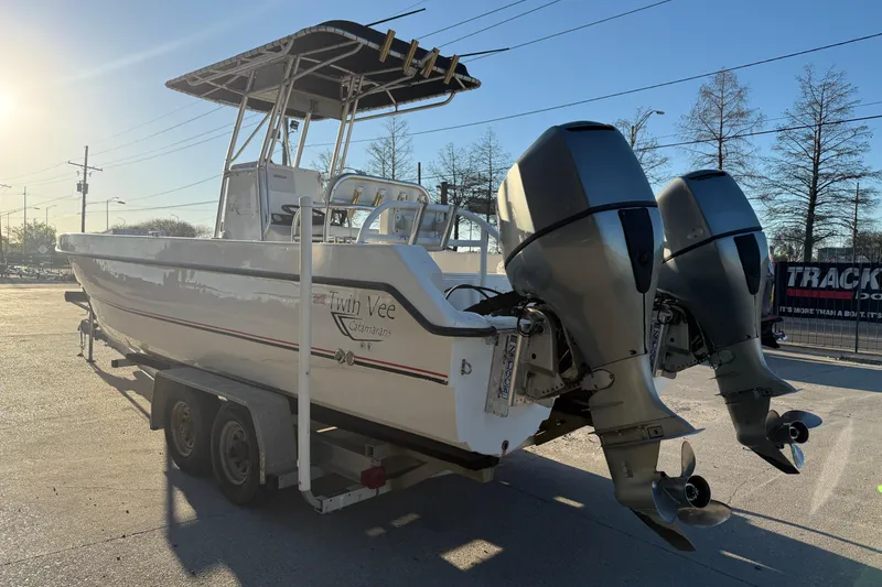 Slide: The Image of 2007 Twin Vee 26 Center Console boat on trailer, dual outboard motors. - 6