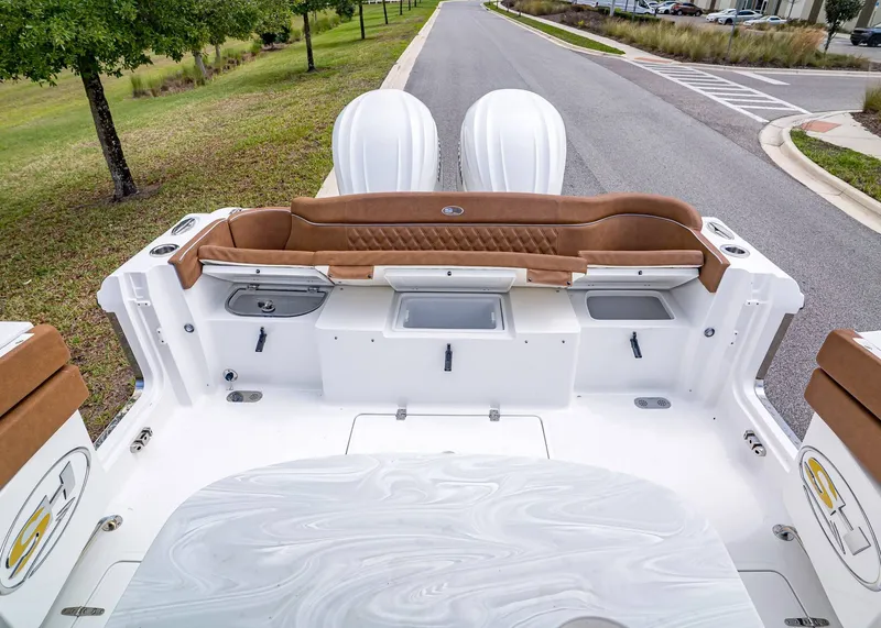 Slide: The Image of Rear view of Sea Hunt ULTRA 305 CB boat, model year 2026. - 11