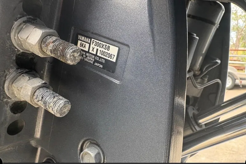 Slide: The Image of Close-up of Yamaha F300XSB engine bolts on a 2022 Cobia 301 Center Console boat. - 20