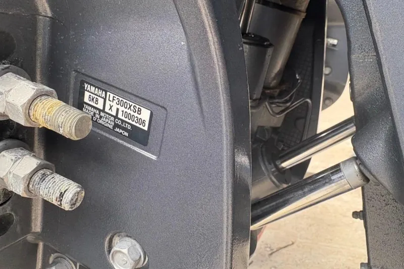 Slide: The Image of Close-up of Yamaha LF300XSB engine components on a 2022 Cobia 301 Center Console boat. - 21