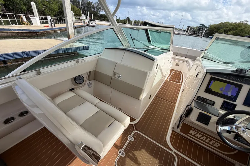 Slide: The Image of 2022 Boston Whaler 320 Vantage boat interior with modern dashboard and seating. - 33
