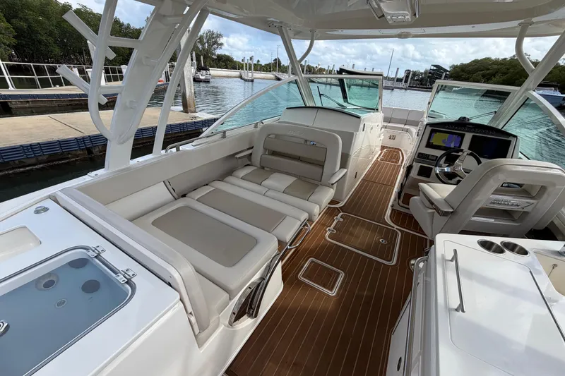 Slide: The Image of 2022 Boston Whaler 320 Vantage boat interior with luxurious seating and modern dashboard. - 34