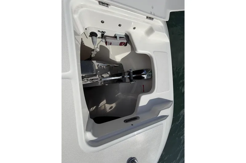 Slide: The Image of 2022 Boston Whaler 320 Vantage anchor compartment, showcasing marine equipment and storage. - 45