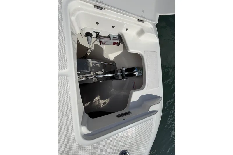 Slide: The Image of Open storage compartment on 2022 Boston Whaler 320 Vantage boat. - 46
