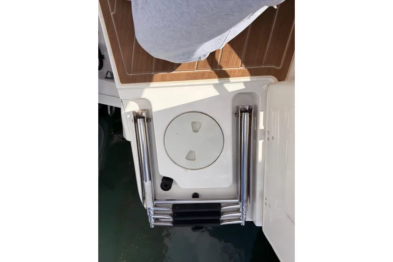Slide: The Image of 2022 Boston Whaler 320 Vantage swim platform with ladder and teak flooring. - 47