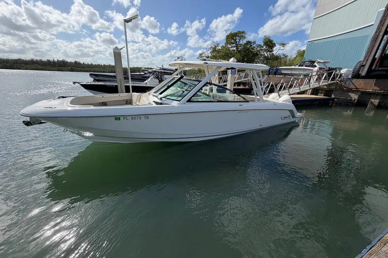 Slide: The Image of 2022 Boston Whaler 320 Vantage boat docked on a sunny day. - 6