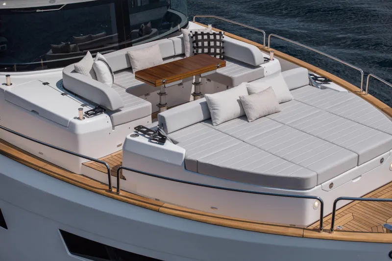 Slide: The Image of Luxurious 2026 Sirena 60 yacht deck with elegant seating and cushions. - 10