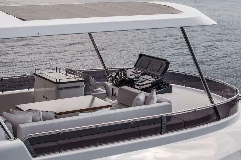 Slide: The Image of Luxurious Sirena 60 yacht deck with modern helm, seating, and ocean view, 2026 model. - 12