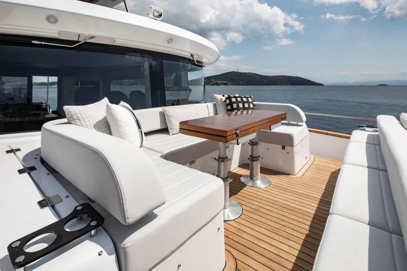 Slide: The Image of Luxurious Sirena 60 yacht deck with elegant seating and ocean view, 2026 model. - 17
