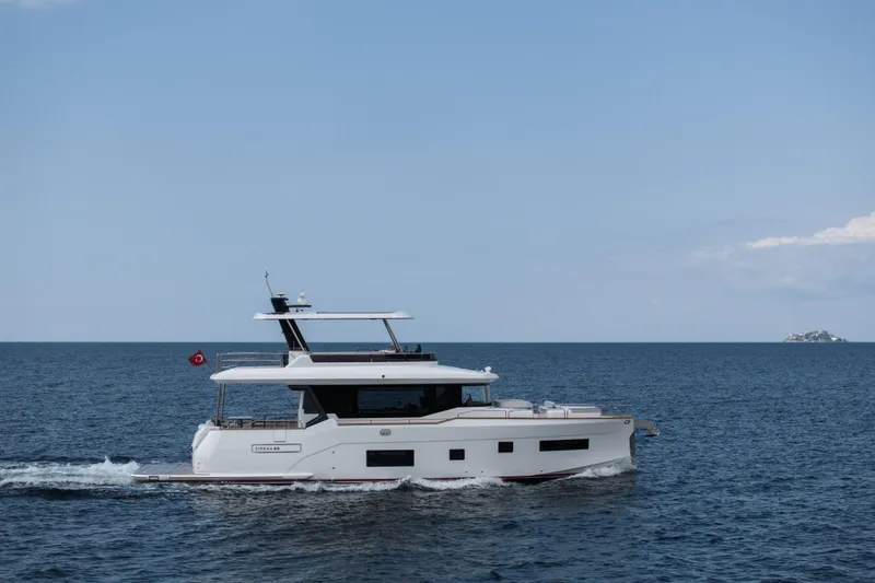 Slide: The Image of Luxury Sirena 60 yacht cruising on open sea, 2026 model. - 2